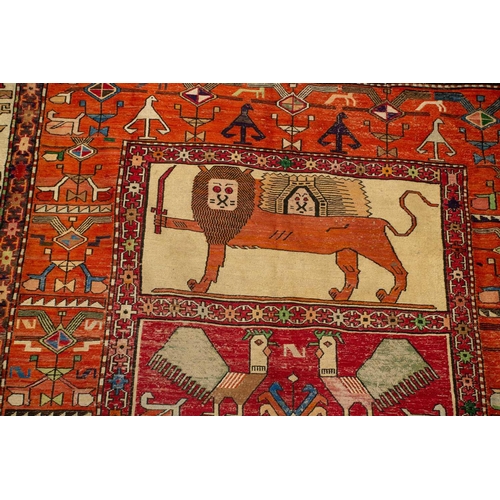 315 - A large Persian silk soumak, the central field with Persian lion, sun and sword, and peacock motifs ... 