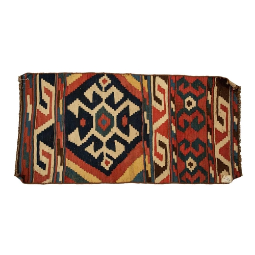 318 - A North African red ground kelim with banded decoration. within a zig-zag border, 1.6 mtrs x 1,1 mtr... 