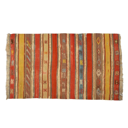 318 - A North African red ground kelim with banded decoration. within a zig-zag border, 1.6 mtrs x 1,1 mtr... 