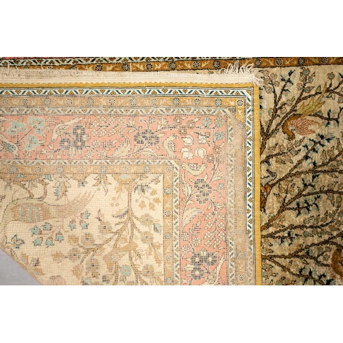 319 - An ivory ground silk on silk Tabriz 