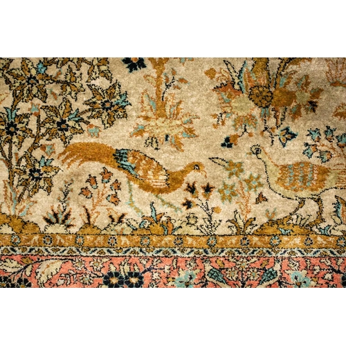 319 - An ivory ground silk on silk Tabriz 