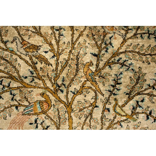 319 - An ivory ground silk on silk Tabriz 