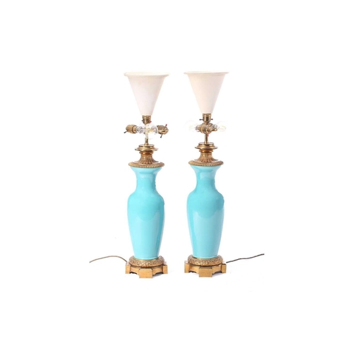 320 - A pair of turquoise glaze table lamps with gilt metal mounts, with later electric fittings, 52 cm hi... 