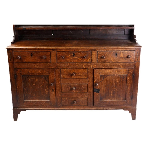 338 - An early 19th century Anglesey type oak and deal dresser base and rack, the rack with two shelves ab... 