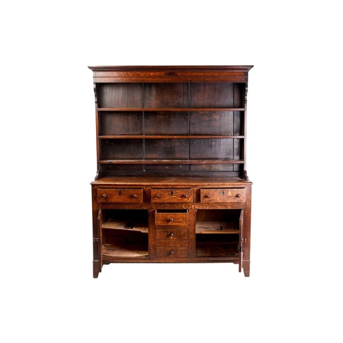 338 - An early 19th century Anglesey type oak and deal dresser base and rack, the rack with two shelves ab... 