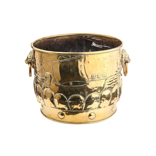 352 - An Arts & Crafts design brass log basket, possibly Glasgow School, the cylindrical bucket with lion ... 