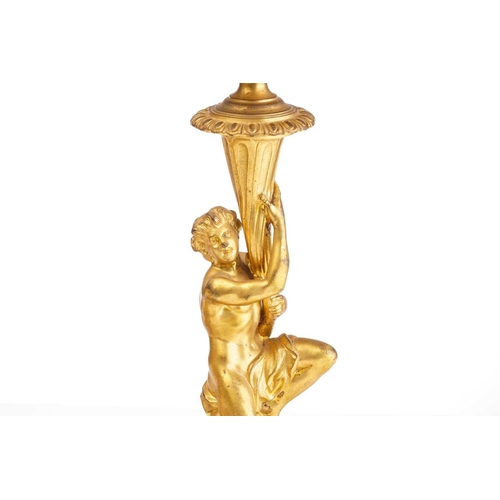 355 - In the manner of Corneille Van Cleve (1646-1732), a pair of French ormolu figural table candlesticks... 