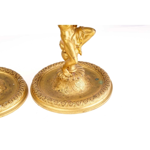 355 - In the manner of Corneille Van Cleve (1646-1732), a pair of French ormolu figural table candlesticks... 