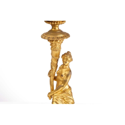 355 - In the manner of Corneille Van Cleve (1646-1732), a pair of French ormolu figural table candlesticks... 