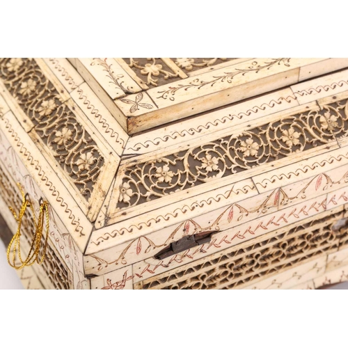 360 - An early 19th century Napoleonic prisoner of war carved bone table box, with fret carved panels and ... 