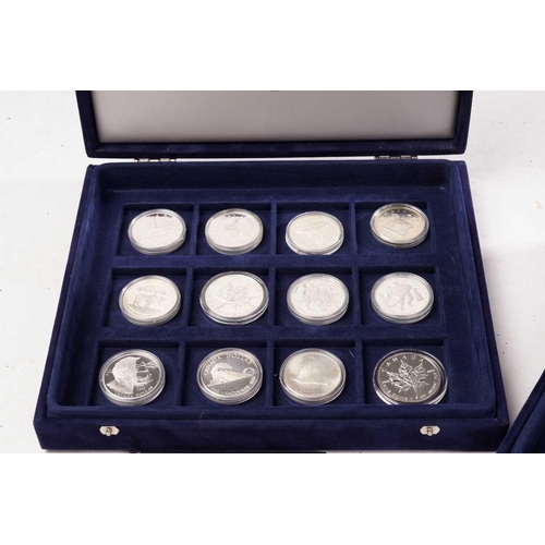 370 - The Official Coins of Australia and The Official Coins of the Royal Canadia Mint a group of twenty f... 