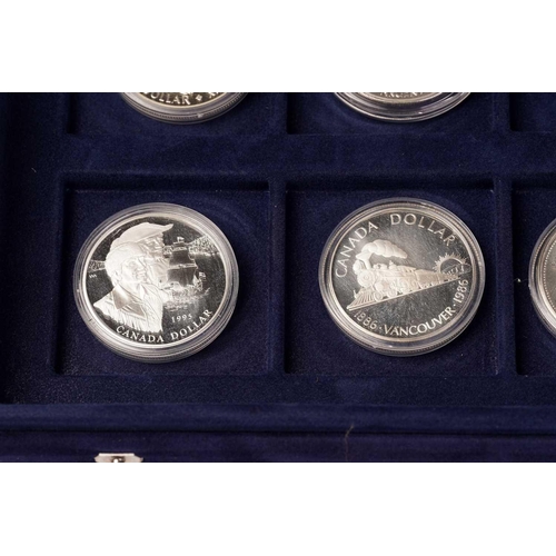 370 - The Official Coins of Australia and The Official Coins of the Royal Canadia Mint a group of twenty f... 