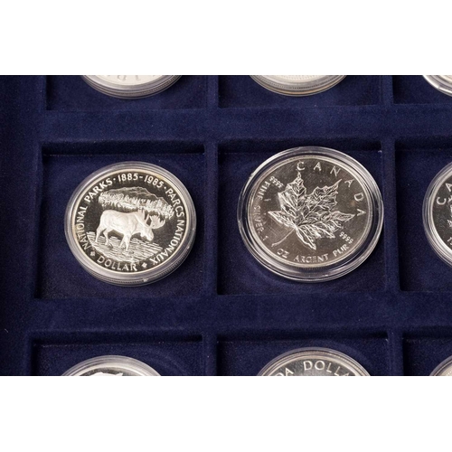 370 - The Official Coins of Australia and The Official Coins of the Royal Canadia Mint a group of twenty f... 