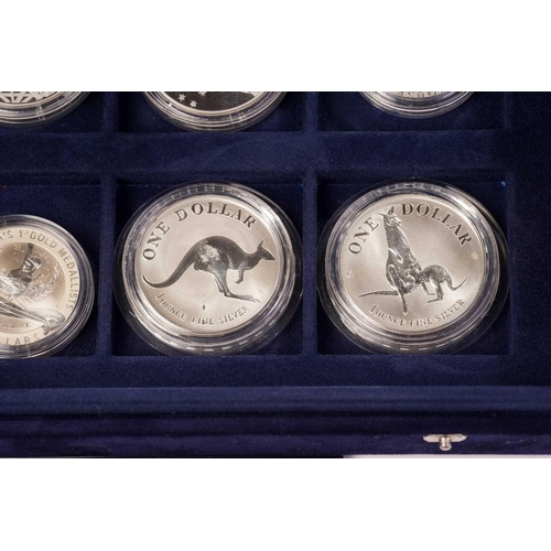 370 - The Official Coins of Australia and The Official Coins of the Royal Canadia Mint a group of twenty f... 