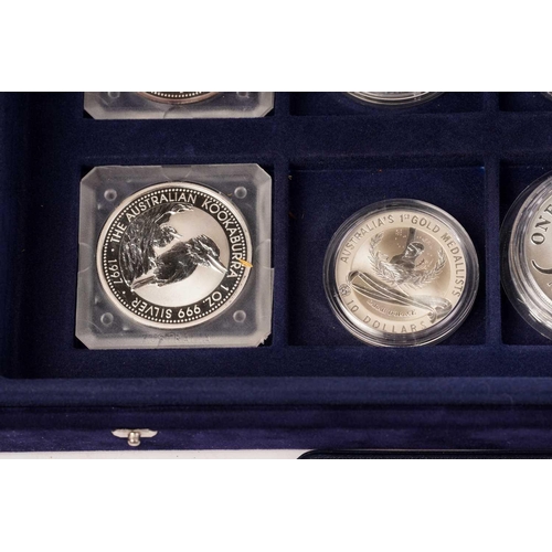 370 - The Official Coins of Australia and The Official Coins of the Royal Canadia Mint a group of twenty f... 