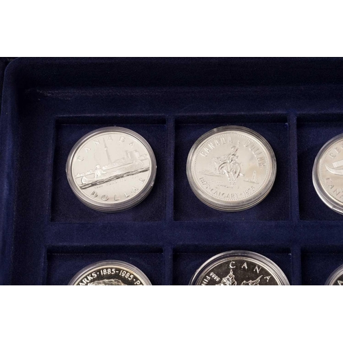 370 - The Official Coins of Australia and The Official Coins of the Royal Canadia Mint a group of twenty f... 