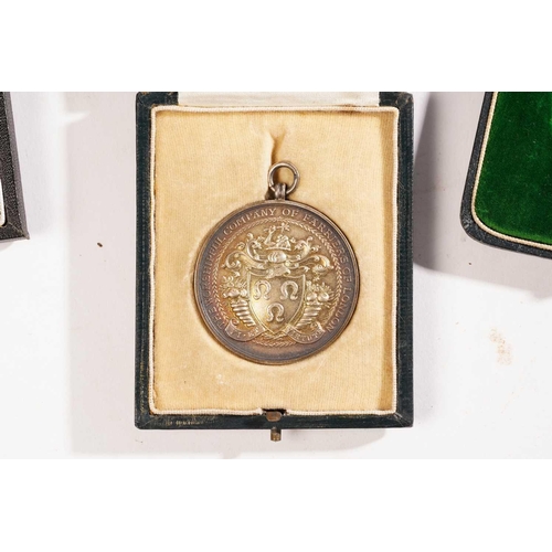 376 - A collection of ten silver, white metal and bronze presentation medallions, comprising a silver gilt... 