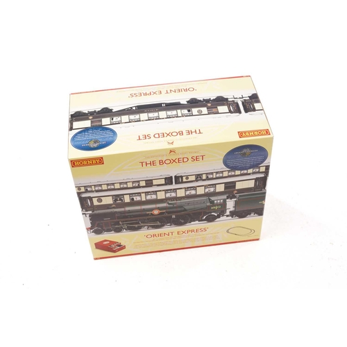 395 - A Hornby 'Orient Express' Boxed Set, unused, together with a part set, Hornby 1039 Flying Scotsman (... 