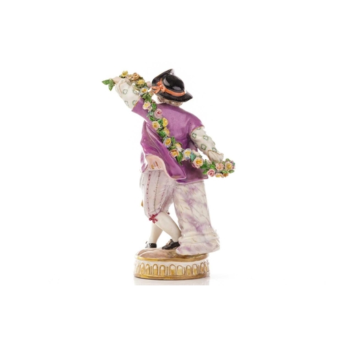 437 - A pair of Meissen figures dressed in purple, the man holding a garland of flowers, both with impress... 