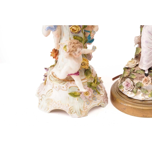 439 - A pair of late 19th-century Continental porcelain figural table lamps ,one mounted with a young gall... 