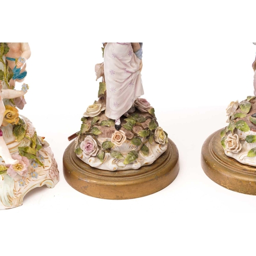 439 - A pair of late 19th-century Continental porcelain figural table lamps ,one mounted with a young gall... 