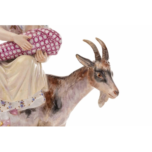 443 - A Meissen figure of the Welsh Tailor`s wife riding goat, the baby and kid feeding from their mother'... 