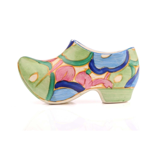 444 - A Clarice Cliff Fantasque design clog in a blue floral design, (with chip), 11 cm long, and a Claric... 