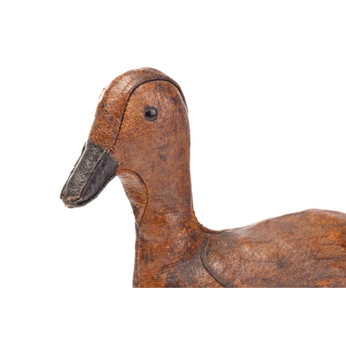 463 - A leather duck form doorstop by Dimitri Omersa for Liberty's, with painted black bill and black lacq... 