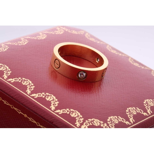 1 - Cartier - 'Love' ring, the polished band set with three brilliant-cut diamonds, and further decorate... 