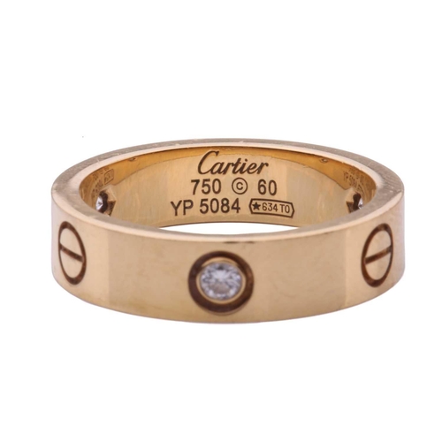 1 - Cartier - 'Love' ring, the polished band set with three brilliant-cut diamonds, and further decorate... 