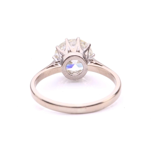 101 - A diamond solitaire ring, featuring a slightly tinted Old-European cut diamond of 8.7 x 8.7 x 5.3 mm... 