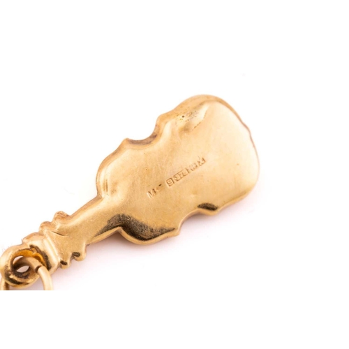 110 - A miscellaneous aggregate of 9ct yellow gold items; including a charm in the form of a gentleman rid... 