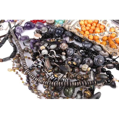 111 - A mixed collection of costume jewellery and other items including a tumbled amethyst bead necklace, ... 