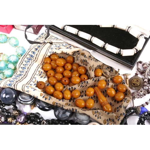 111 - A mixed collection of costume jewellery and other items including a tumbled amethyst bead necklace, ... 