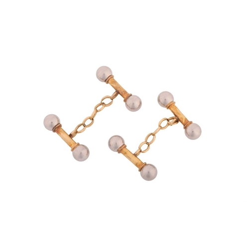 112 - A pair of two-toned cufflinks, in the form of barbells, each consisting of a yellow-tone bar termina... 