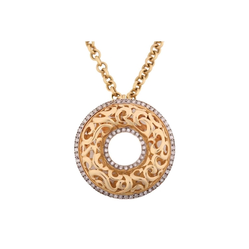 115 - An annular pendant on chain, consisting of a hollow torus with scrollwork designs, embellished with ... 