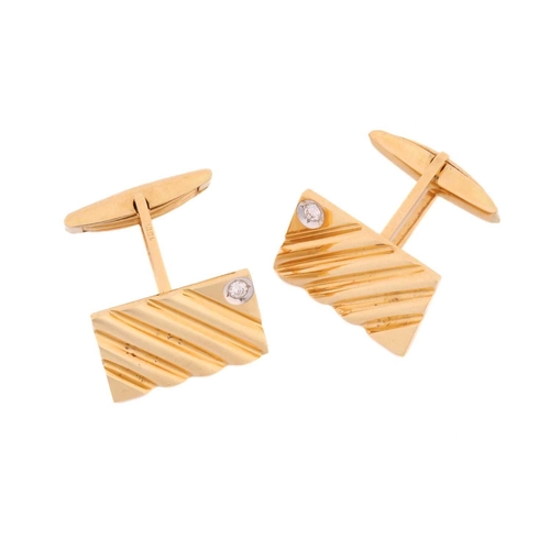 118 - A pair of cufflinks with diamond accents, each comprising a diagonally striated rectangular panel, s... 