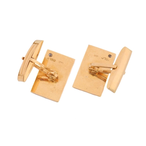 118 - A pair of cufflinks with diamond accents, each comprising a diagonally striated rectangular panel, s... 