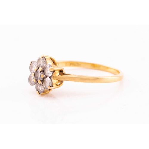 119 - A diamond cluster ring, featuring seven round brilliant cut diamonds claw set into 18ct yellow gold ... 