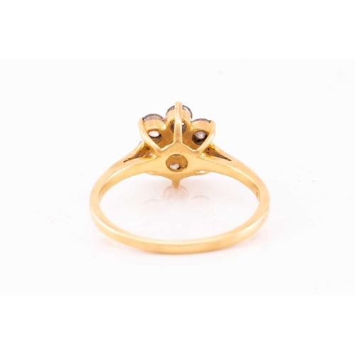 119 - A diamond cluster ring, featuring seven round brilliant cut diamonds claw set into 18ct yellow gold ... 