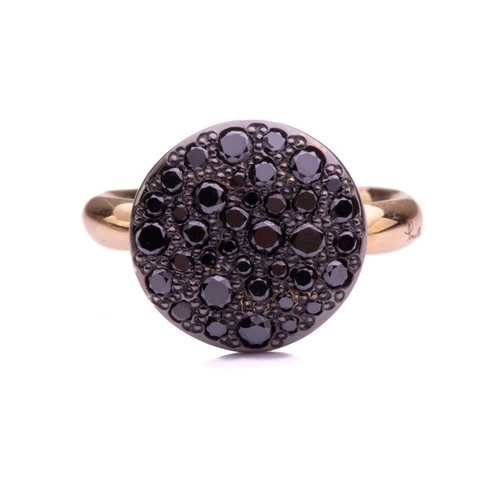 12 - Pomellato - 'Sabbia' ring set with treated black diamonds, ring head comprising a round textured pan... 