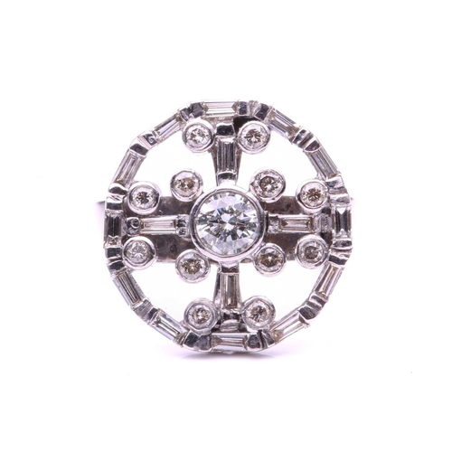 123 - A diamond cartwheel ring; the central round brilliant cut diamond in collet mount and within a surro... 