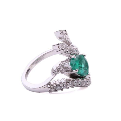 137 - An emerald and diamond cocktail ring, featuring a pear-shaped emerald with bright bluish-green body ... 