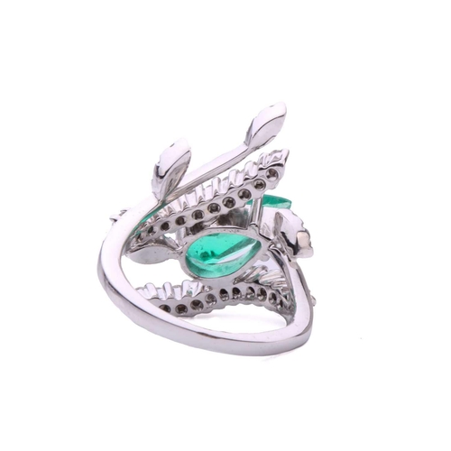 137 - An emerald and diamond cocktail ring, featuring a pear-shaped emerald with bright bluish-green body ... 