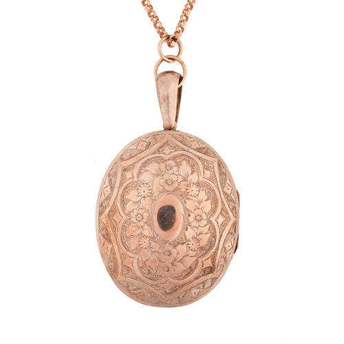 139 - A large locket and chain, the locket measures 41x51mm with deep engraving and with a large top loop ... 