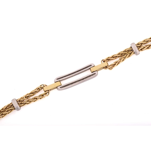 140 - A two-tone bracelet set with diamonds, containing an elongated double bar pavé set with circular-cut... 