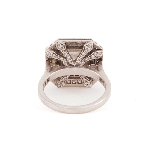 141 - An Art Deco style diamond ring, the central Asscher cut diamond within a two-row surround of round b... 