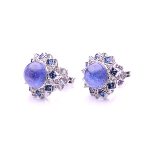 143 - A pair of sapphire, diamond and cabochon tanzanite cluster earrings; of overlapping star design with... 