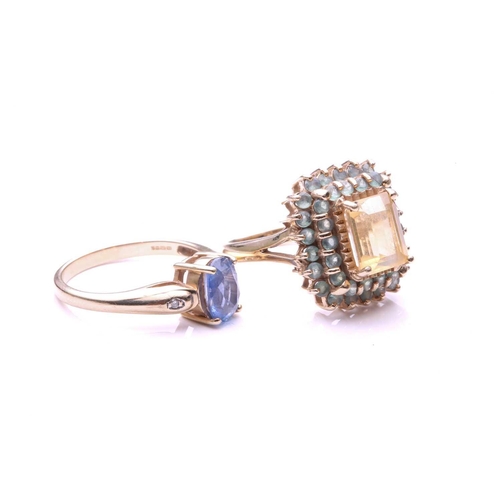 144 - A pale sapphire ring; the oval cut sapphire in four claw mount, the tapering shoulders set with sing... 