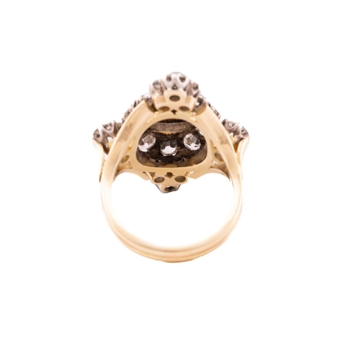 147 - A diamond and pearl cocktail ring, the lozenge panel centred with an off-round pearl of 8.0 mm with ... 